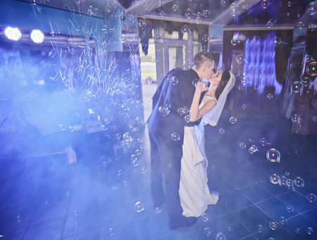 beautiful caucasian couple just married and dancing their first dance