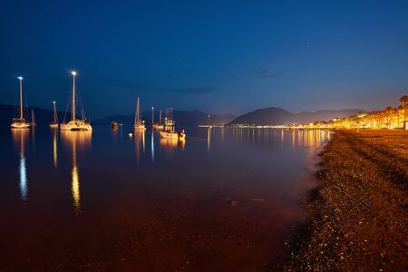 View over the beach coast of Marmaris in Turkey at duskの写真素材