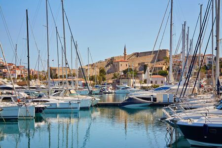 Marina yachts and buildings on background in Cesme, Turkeyの写真素材