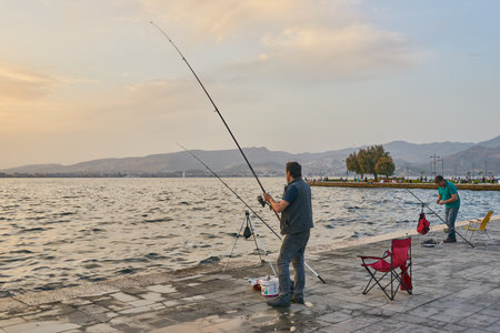 Izmir, Turkey - May 4, 2018: Fishermen in the Izmir Smyrna coasts of Aegean Sea.のeditorial素材