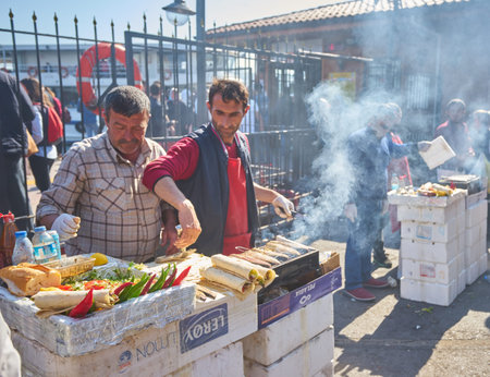 ISTANBUL, TURKEY - APRIL 23, 2018: Unidentified vendor sale street food at Istanbul side street,...