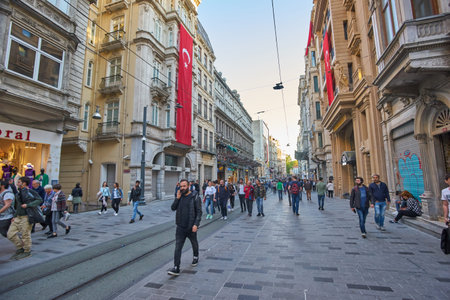 Istanbul, Turkey April 23, 2018: Nostalgic Red Tram in Taksim Istiklal Street at evening. Taksim...