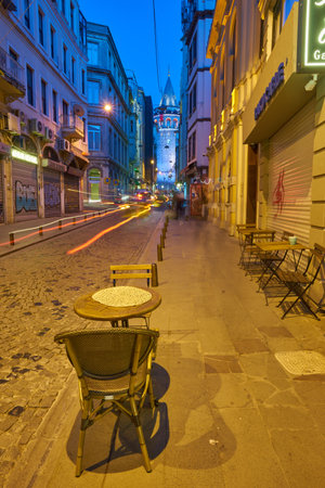 ISTANBUL, TURKEY - APRIL 23: Magnificent night view of Galata Tower, framed by city buildings - Istanbul.のeditorial素材