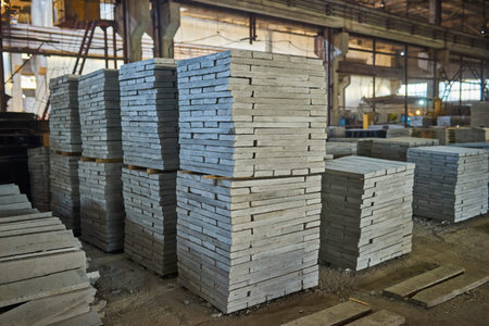 Manufacturing concrete slabs. reinforced concrete production. Workers working with metal, welding reinforcement for concrete reinforcement. House-building plant. Industrial interior. Concrete plant.の写真素材