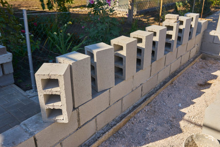 Stack of cement blocks at the construction site. cinder blocks background
