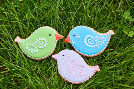 Easter composition with easter cookies rabbits on green grass background. Easter concept with copy...