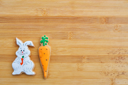 Easter homemade gingerbread cookie over wooden tableの写真素材