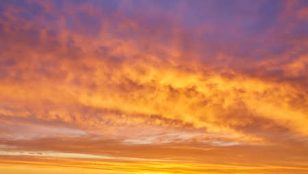 Beautiful stormy sunset sky. Cloudy abstract background. Sunset colors.の写真素材