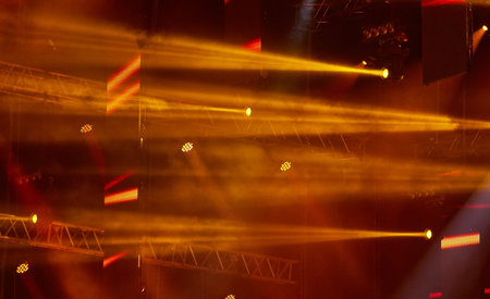 Yellow and orange foggy show lights during rock concert