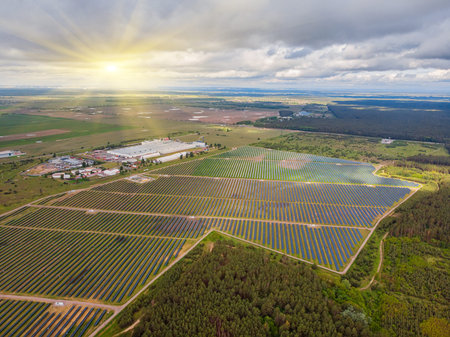 Solar power plant in the field. Aerial view of Solar panels. Solar farm. The source of ecological...
