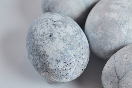Close-up of Easter eggs. Stylish easter blue eggs. Series of eggs with marble stone effect paintedの写真素材