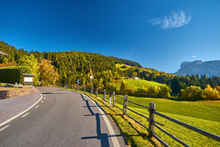 Scenic mountain road in Val Di Funes alpine valley, Dolomites Mountains, Italyの写真素材