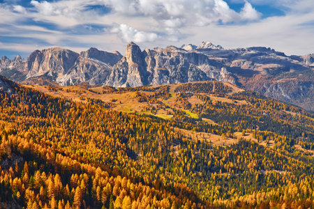 Autumn morning alpine Dolomites mountain scene. Peaceful Valparola Path view, Belluno, Italy. Picturesque traveling, seasonal, and nature beauty concept scene.の写真素材