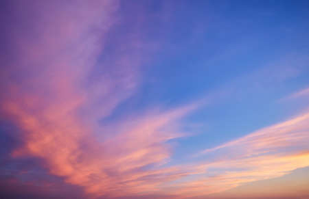 Abstract nature background. Dramatic and moody pink, purple and blue cloudy sunset skyの写真素材