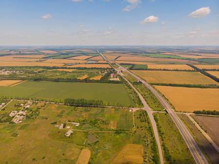 Aerial landscape of summer farm wheat field harvest cropsの写真素材