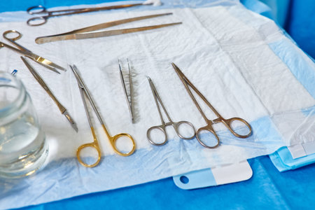 Scissors surgical with torundas in an operating theater, composition horizontal, conceptual image