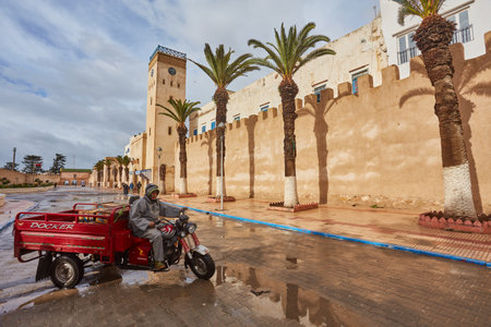 ESSAOUIRA, MOROCCO. 12 th February, 2017: Streets of the old city, Medina, colorful houses. People rushing to work, the city after the rainのeditorial素材