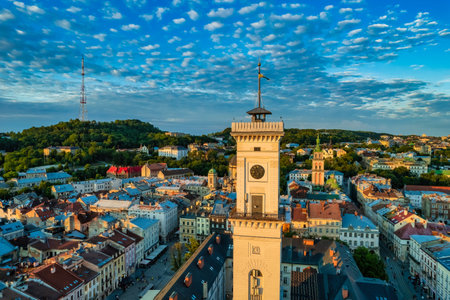 Rooftops of the old town in Lviv in Ukraine during the day. The magical atmosphere of the European city. Landmark, the city hall and the main square. Drone photo.の写真素材