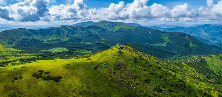 Photo taken with a drone at a cross on a mountain ridge. Summer photo of the mountain range in the Carpathiansの写真素材