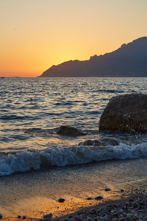 Rocky Cliffs and Mountain Landscape by the Tyrrhenian Sea. Amalfi Coast, Italy. nature background. Sunset Skyの写真素材