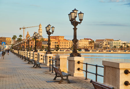 Panoramic view of Bari, Southern Italy, the region of Puglia, Apulia seafront at dusk. Basilica San...