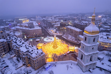 Christmas tree with lights outdoors at night in Kiev. Sophia Cathedral on background. New Year Celebrationの写真素材