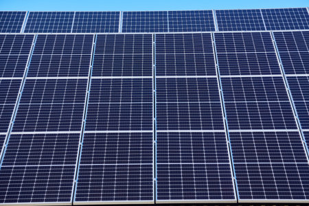 Solar panels on small wood board domestic house roof, sustainable energy concept. Lot of copy space...