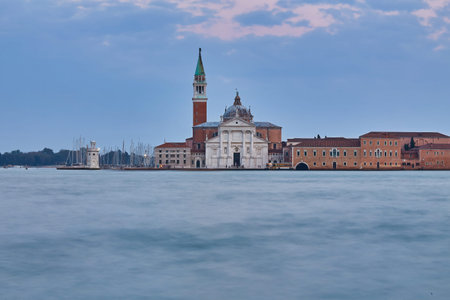 Scenic view of St George Church and Island in the Giudecca Canal, as seen at night from St Mark's district in Venice, Italyの写真素材