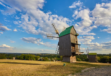 Traditional Ukrainian windmill in the museum of national architecture in Pirogovo in a beautiful summer day, Kiev, Ukraineの写真素材