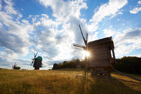 Traditional Ukrainian windmill in the museum of national architecture in Pirogovo in a beautiful summer day, Kiev, Ukraineの写真素材