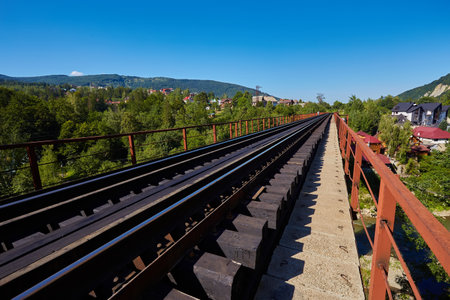 View on railway bridge above the Prut river. Beautiful autumn in Carpathian mountains, Yaremche, Ukraineの写真素材