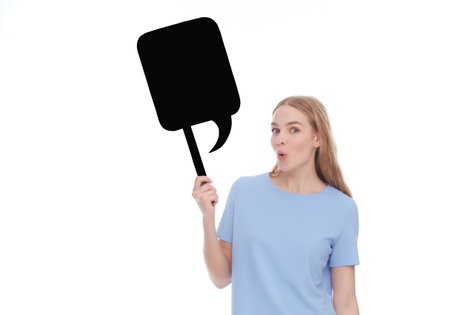 emotional young woman showing empty signboard with copy space isolated on whiteの写真素材