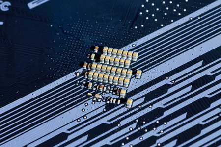 Detailed view of motherboard traces and surface-mounted components, illustrating the precision of circuit board design. This image is perfect for technical content related to electronics or PC hardware.の写真素材