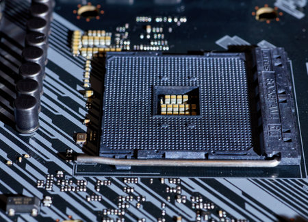 A close-up view of an AM4 CPU socket on a motherboard. This detailed image shows the precision of the socket pins and the structure, perfect for hardware-related content or tech tutorials.の写真素材