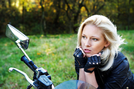 The girl the blonde on a motorcycleの写真素材