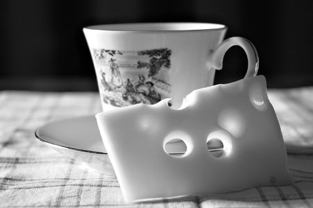 Cup and cheese pieceの写真素材