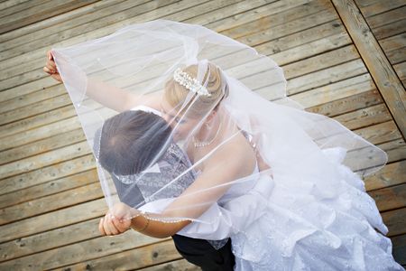 Happy groom and bride on wedding walk の写真素材