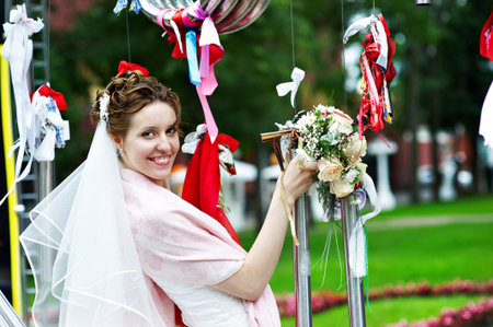 Elegant Bride at metal installation in the Park Hermitage. Moscowの写真素材