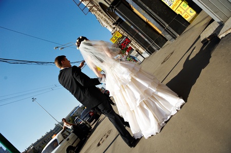 Bride and groom at a wedding a walk in the city of Moscowの写真素材