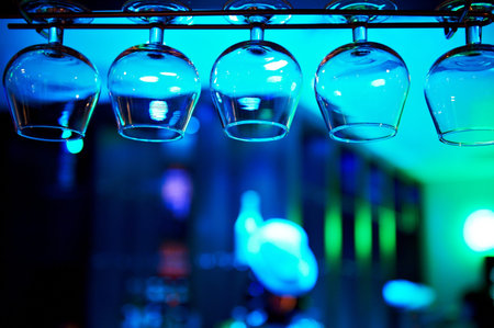 Glasses of brandy over the bar on a blue background
