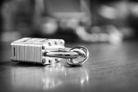 Gold wedding rings on the lock lovers. Together forever.の写真素材