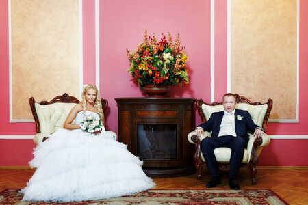 Elegant bride and rich groom in luxury wedding palaceの写真素材