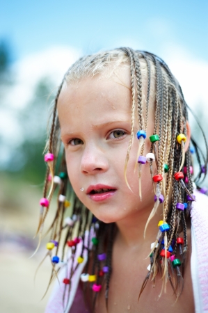 Portrait of a girl with colorful pigtailsの写真素材