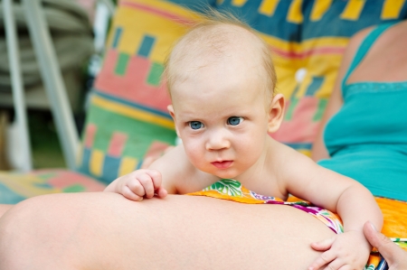Little baby on lap of motherの写真素材