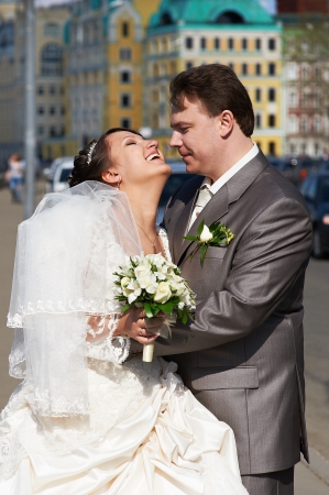 Happy couple bride and groom in the cityの写真素材