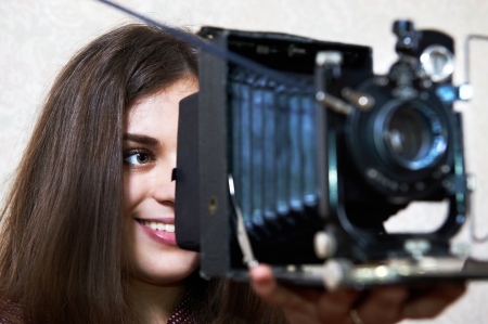 Young girl with big old camera rarityの写真素材