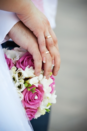 Hands with wedding gold rings happy newlywedsの写真素材