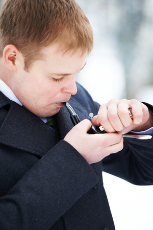 Handsome man smokes pipeの写真素材