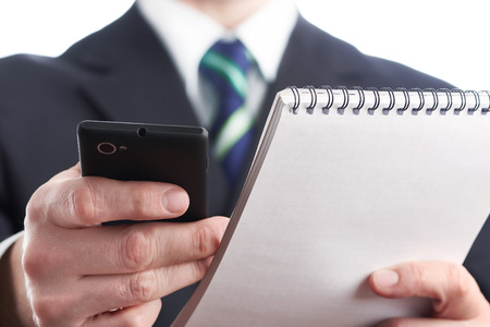 Businessman using smart phone isolatedの写真素材