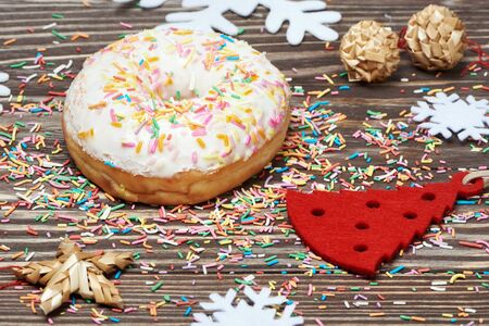 Christmas treats and decorations on the wooden backgroundの写真素材